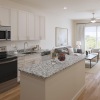 a kitchen with white cabinets