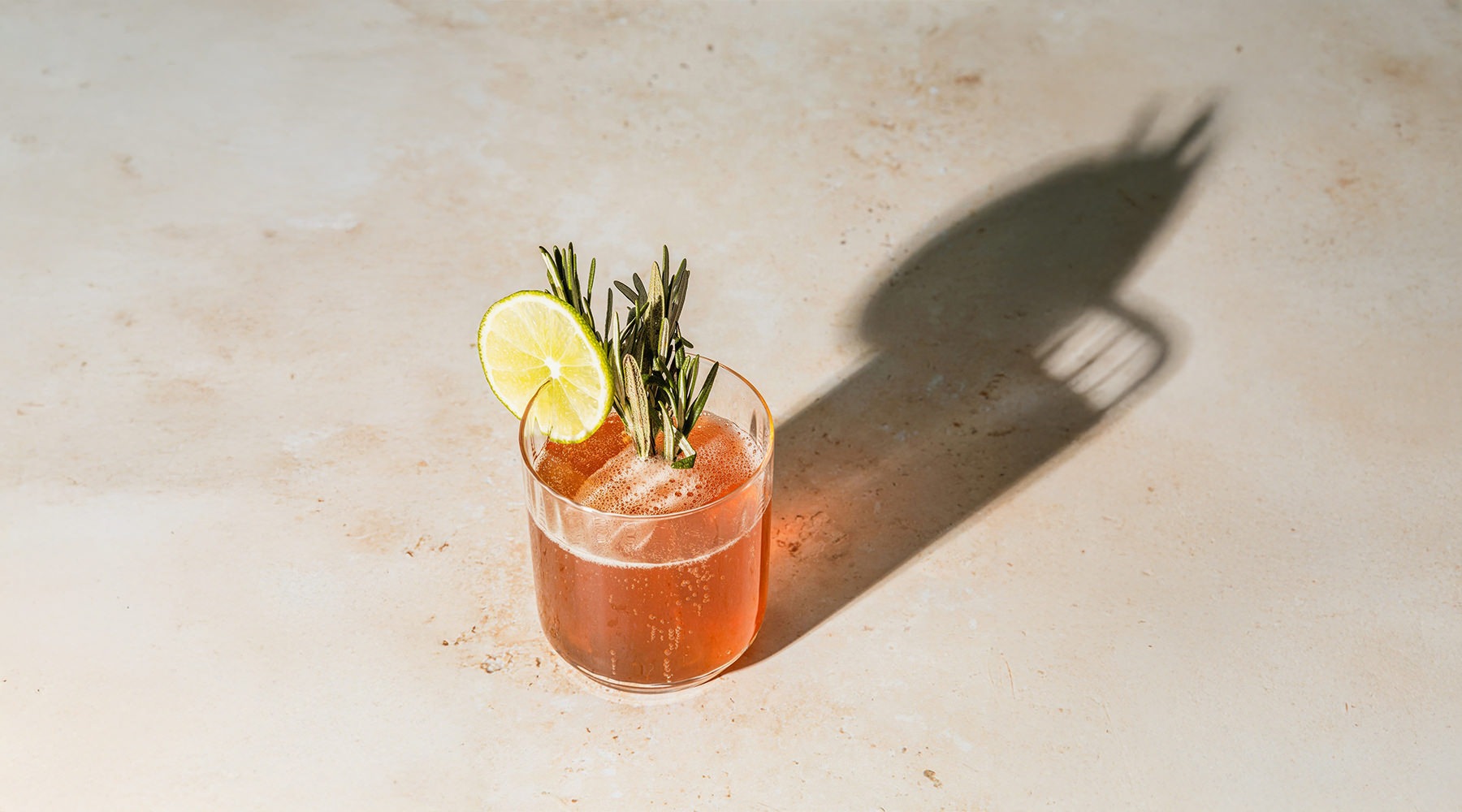 A fizzy drink with garnishes.